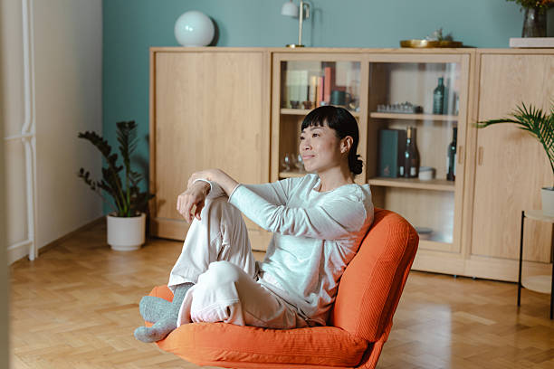 Person practising a gentle seated stretch at home